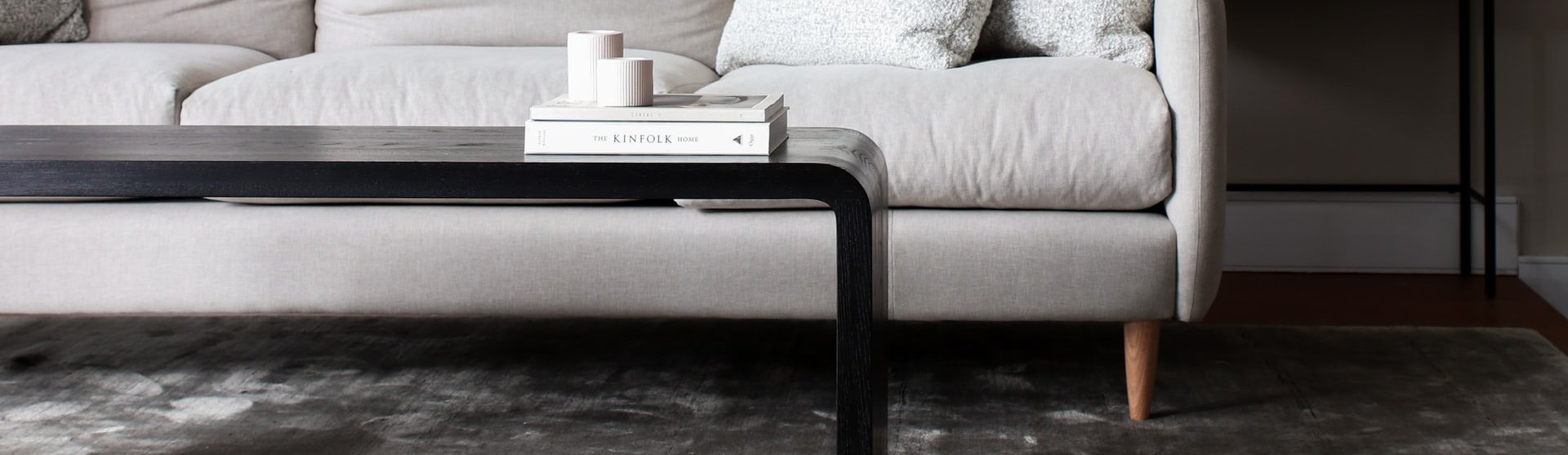 white couch and black coffee table on a brown hardwood floor John's Flooring in Union, MO